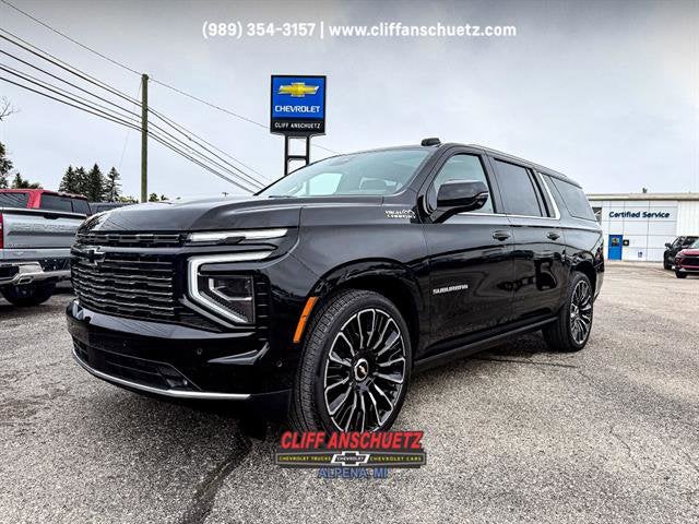 2025 Chevrolet Suburban High Country in Black — front three-quarter view
